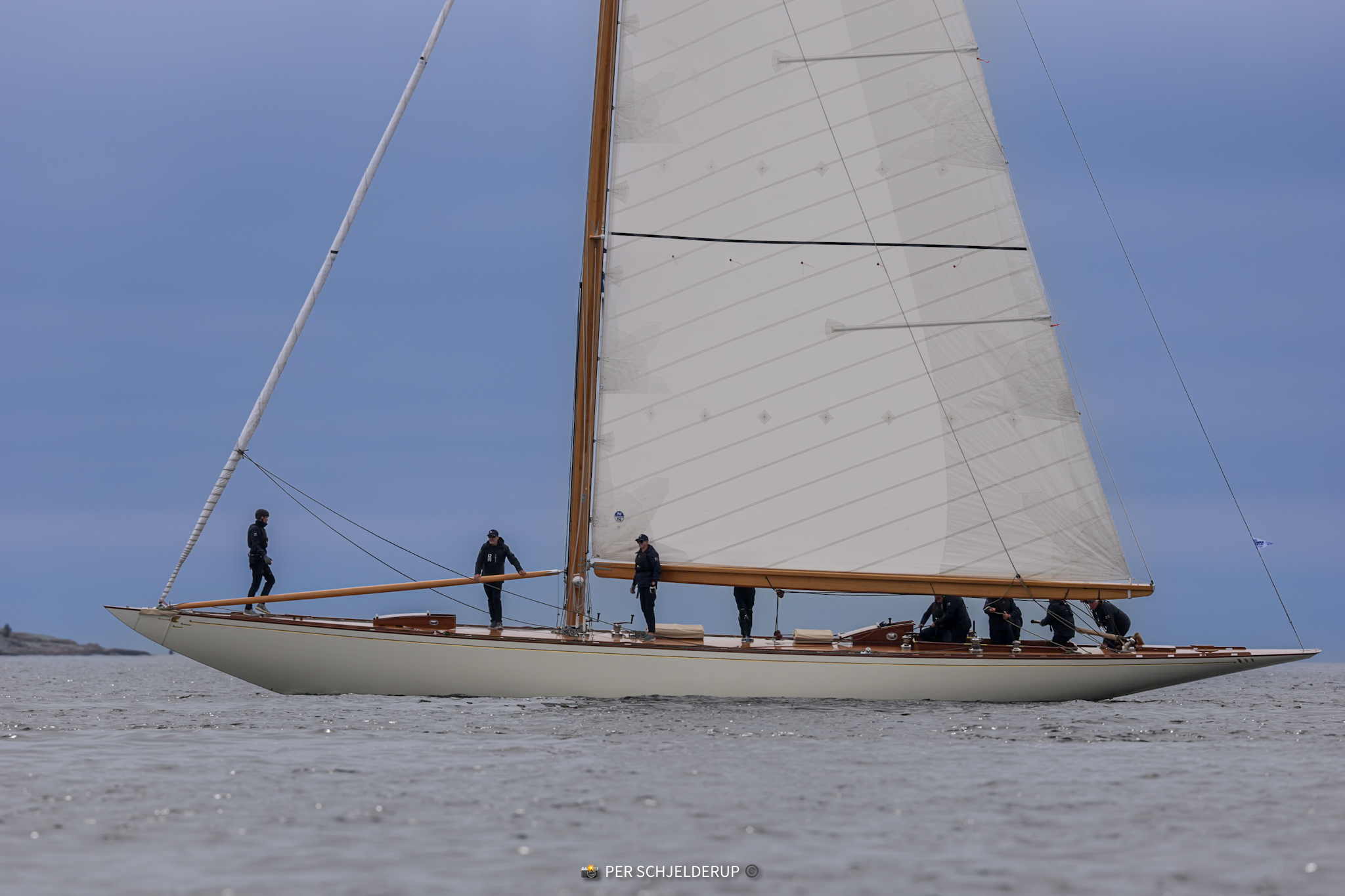 Princess Svanevit ghosting in light air off Helsinki, her bowman forward on the long foredeck.